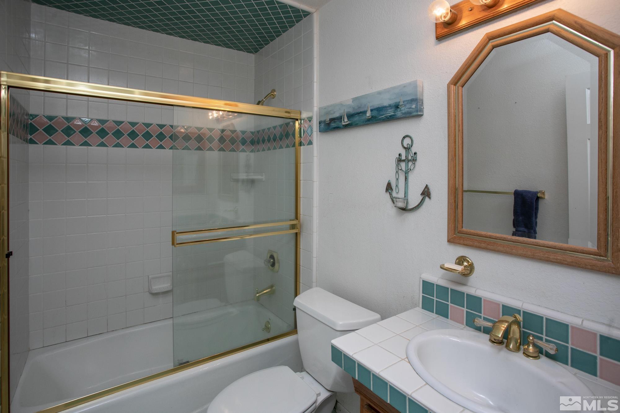 5335 Seville Court Reno, NV 89523 - Photo 17 of 31 a bathroom with a sink a toilet and shower