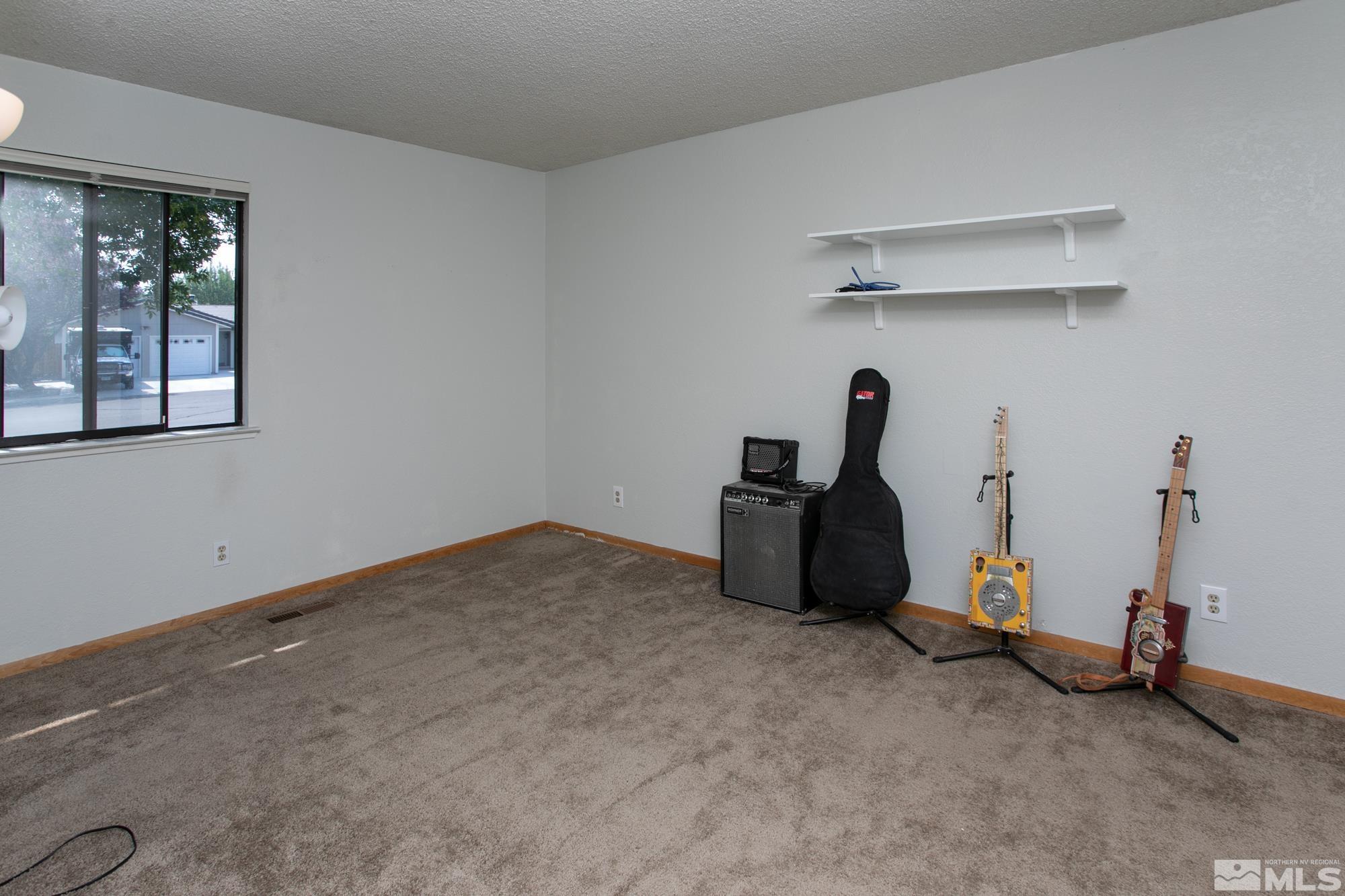 5335 Seville Court Reno, NV 89523 - Photo 18 of 31 a room with gym equipment and a table