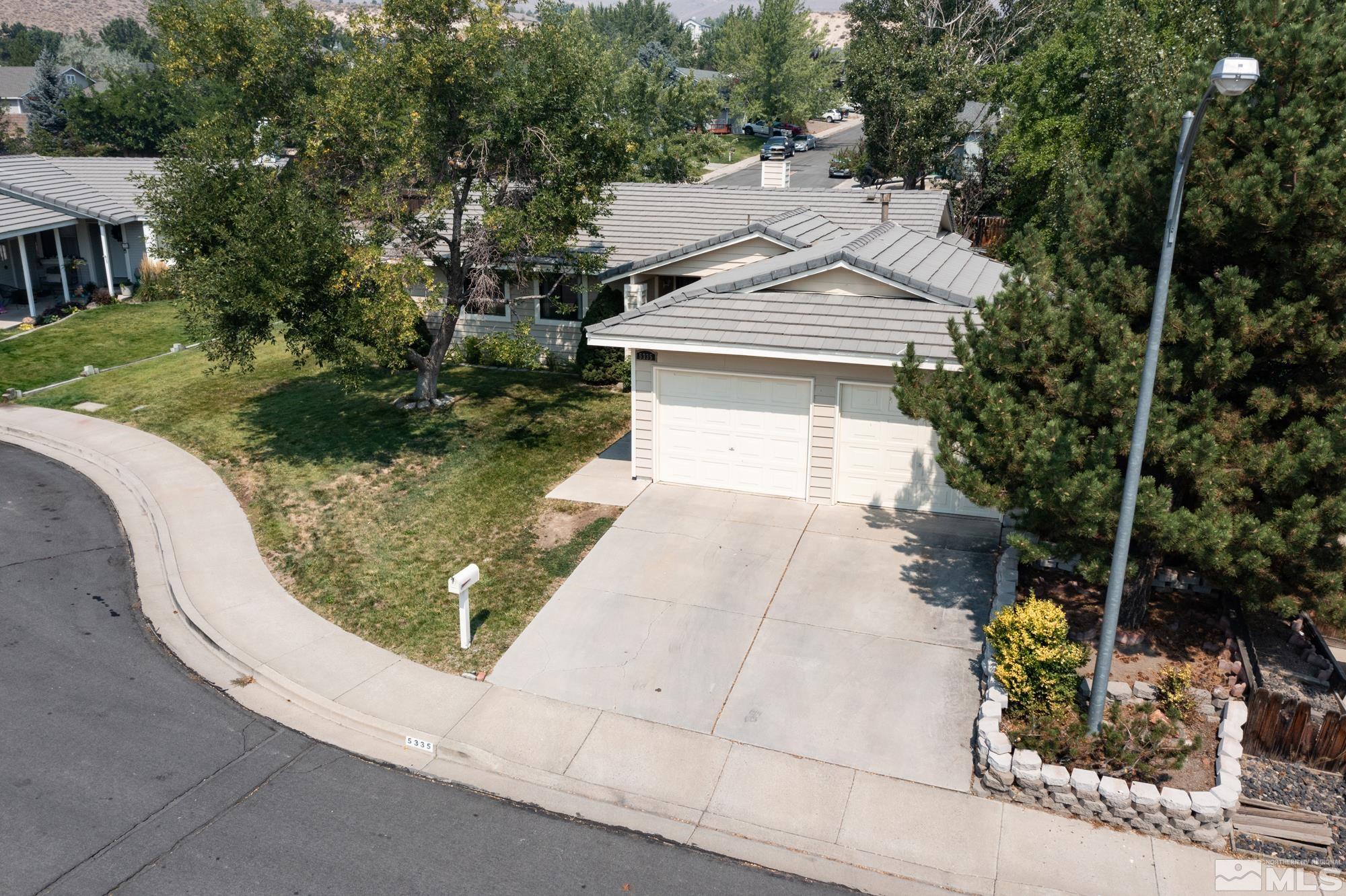 5335 Seville Court Reno, NV 89523 - Photo 2 of 31 a view of a house with a yard and potted plants