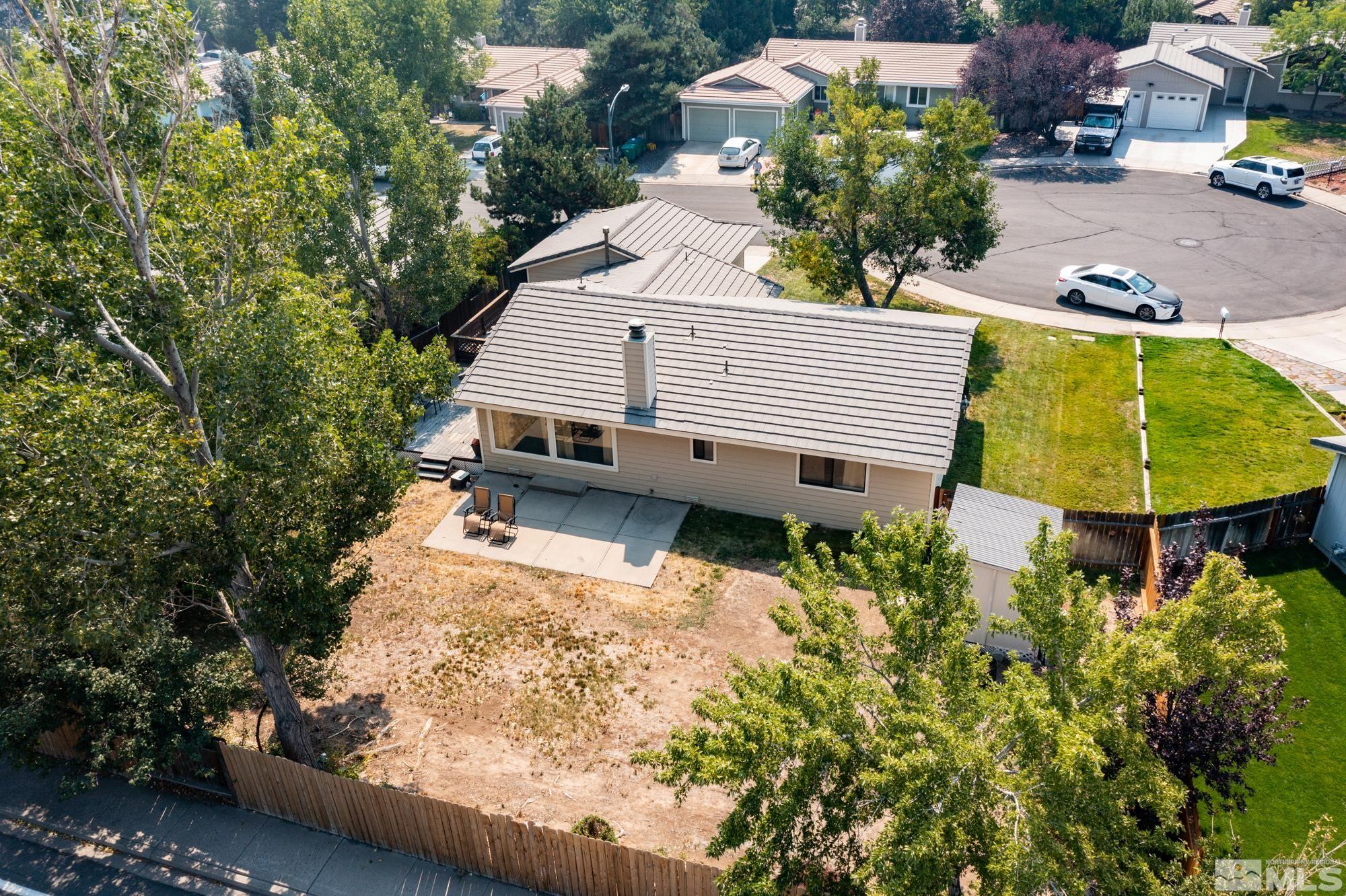 5335 Seville Court Reno, NV 89523 - Photo 24 of 31 a view of a backyard with plants and a patio