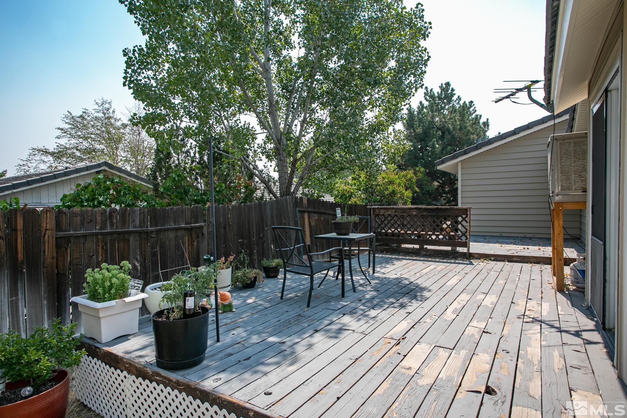 5335 Seville Court Reno, NV 89523 - Photo 27 of 31 a view of balcony with outdoor seating and plants