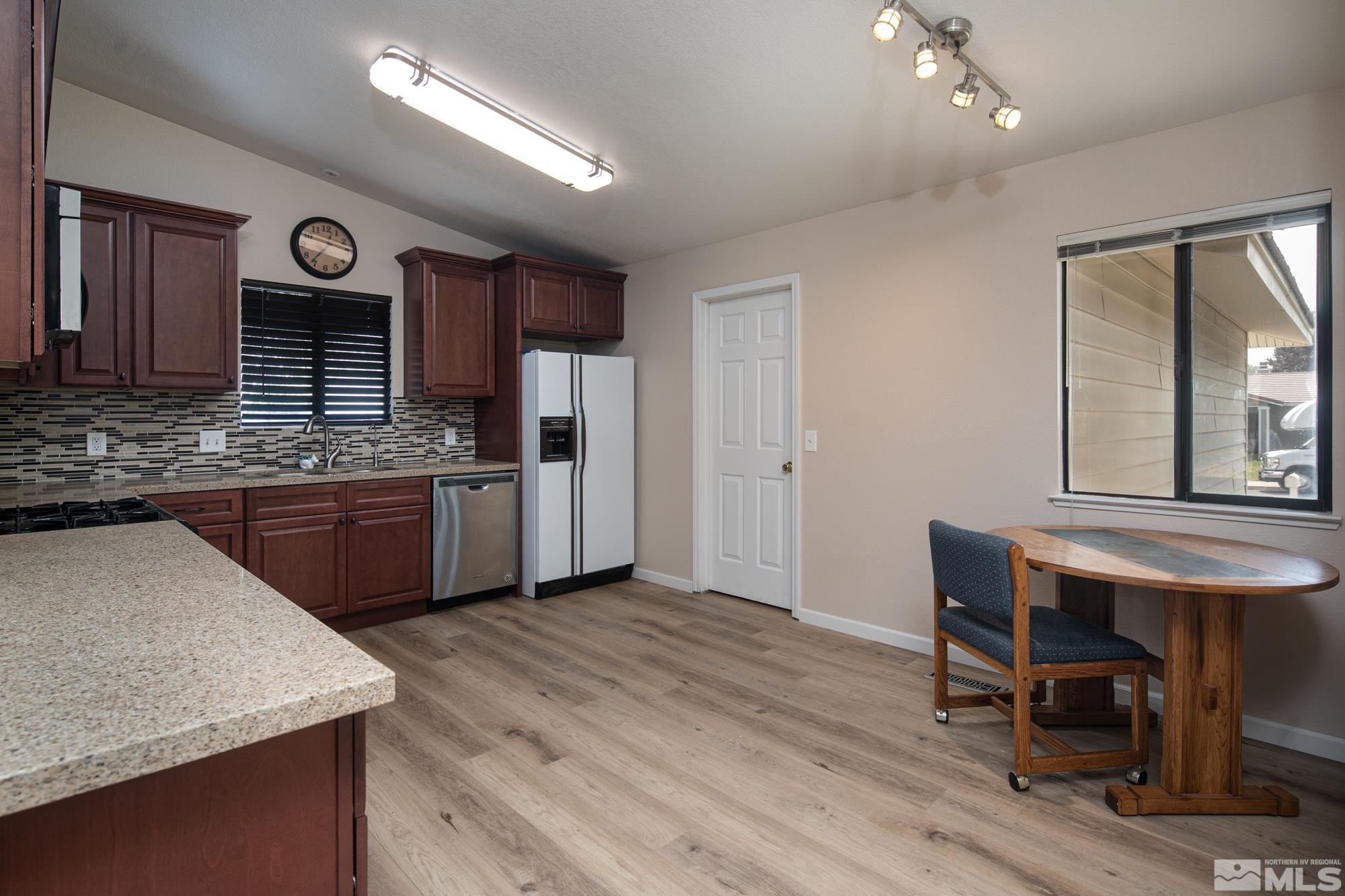 5335 Seville Court Reno, NV 89523 - Photo 6 of 31 a kitchen with cabinets and outdoor seating