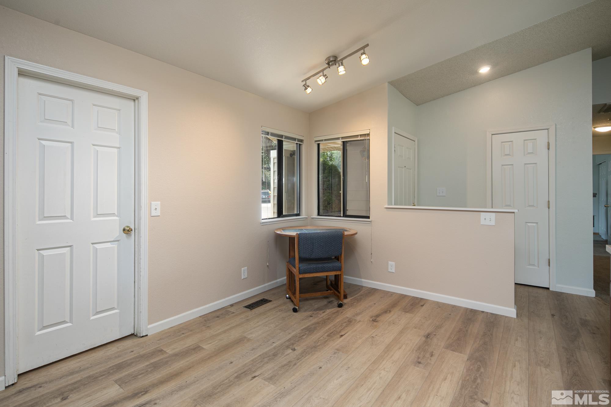 5335 Seville Court Reno, NV 89523 - Photo 10 of 31 an empty room with wooden floor and windows