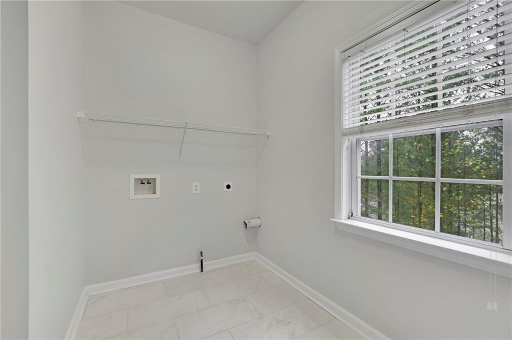 11420 Crossington Road Alpharetta, GA 30005 - Photo 17 of 39 a view of an empty room with a window