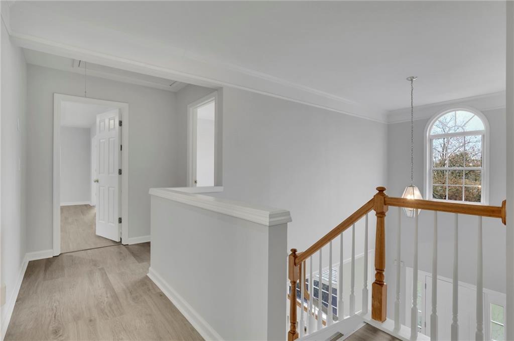11420 Crossington Road Alpharetta, GA 30005 - Photo 20 of 39 a view of entryway with wooden floor