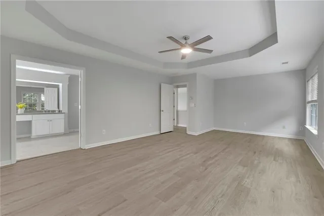a bathroom with a granite countertop double sink and a mirror
