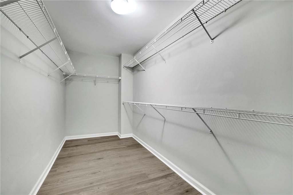 11420 Crossington Road Alpharetta, GA 30005 - Photo 28 of 39 a view of a room with racks on the wall