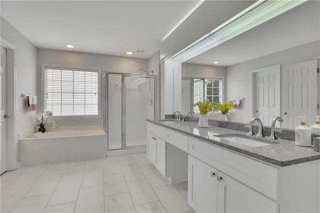 a front view of house with a garden and deck