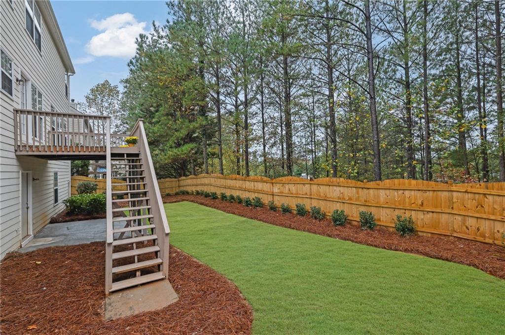 11420 Crossington Road Alpharetta, GA 30005 - Photo 35 of 39 a view of a deck with a yard