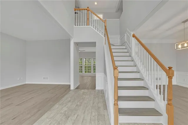 a view of an entryway with wooden floor