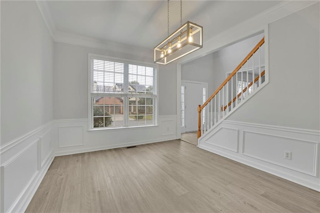 11420 Crossington Road Alpharetta, GA 30005 - Photo 6 of 39 a view of an entryway with wooden floor