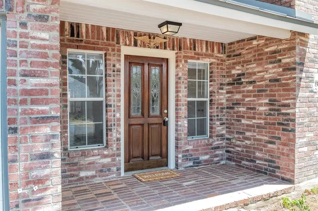 a front view of a house with a glass door