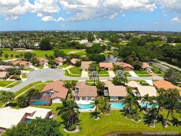 19625 Back 9 Drive Boca Raton, FL 33498 - Photo 1 of 13 an aerial view of residential houses with outdoor space