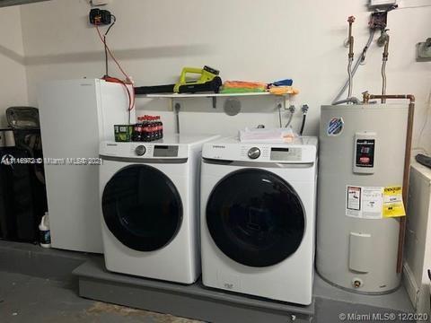 19625 Back 9 Drive Boca Raton, FL 33498 - Photo 13 of 13 a utility room with dryer and washer