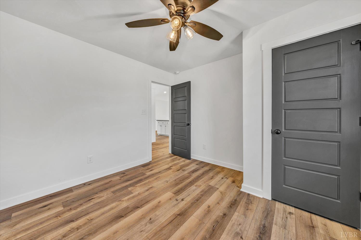 1484 White House Road Moneta, VA 24121 - Photo 18 of 27 a view of empty room with wooden floor