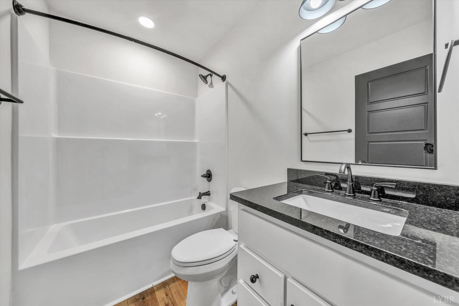 1484 White House Road Moneta, VA 24121 - Photo 19 of 27 a bathroom with a granite countertop sink toilet and shower