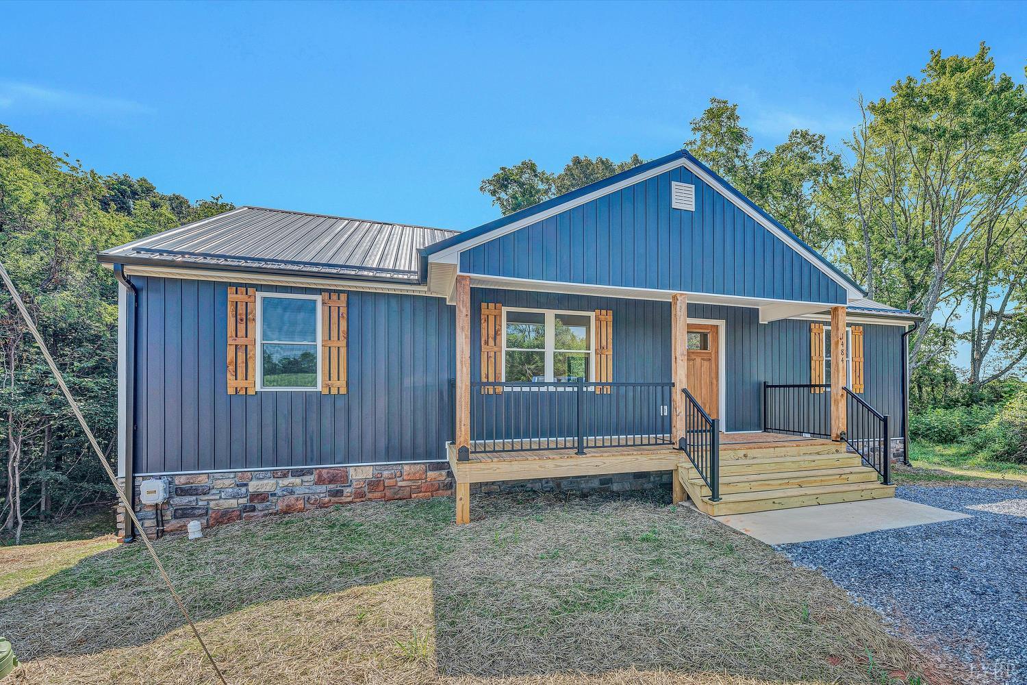 1484 White House Road Moneta, VA 24121 - Photo 2 of 27 a front view of a house with a yard