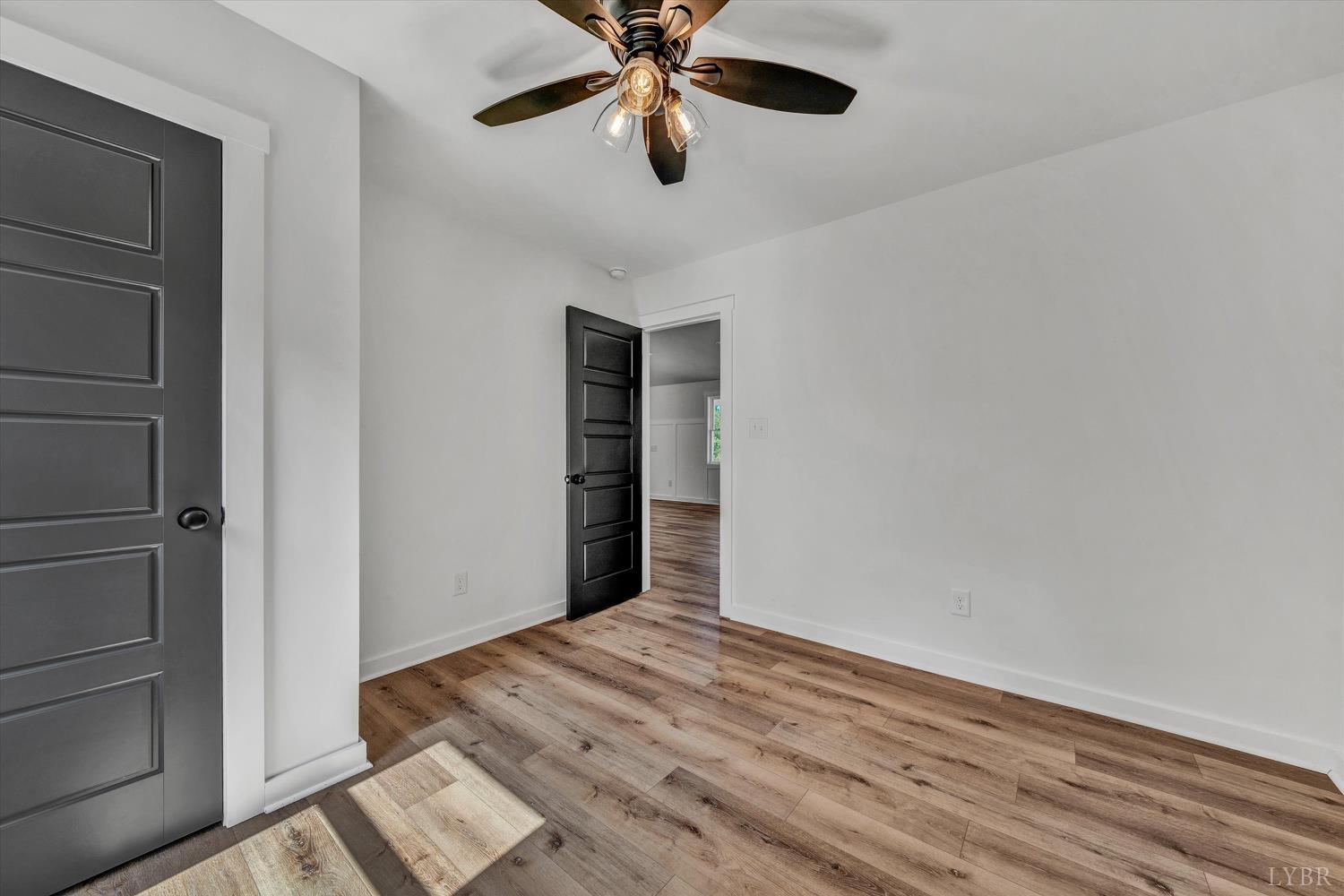 1484 White House Road Moneta, VA 24121 - Photo 21 of 27 a view of empty room with wooden floor
