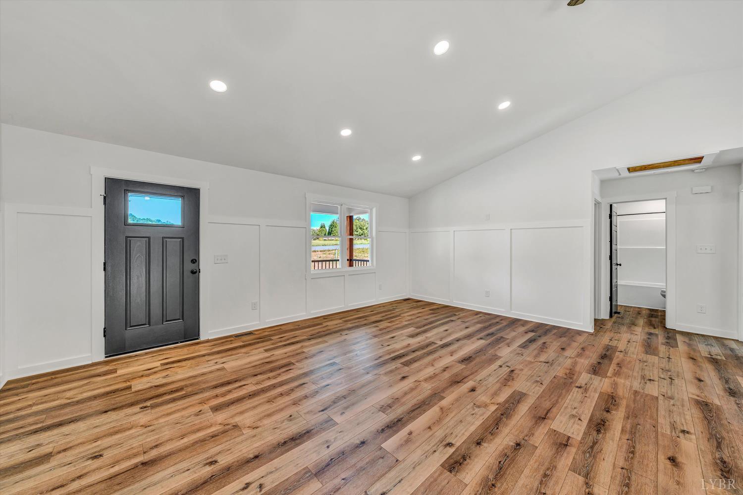 1484 White House Road Moneta, VA 24121 - Photo 3 of 27 a view of empty room with window and wooden floor