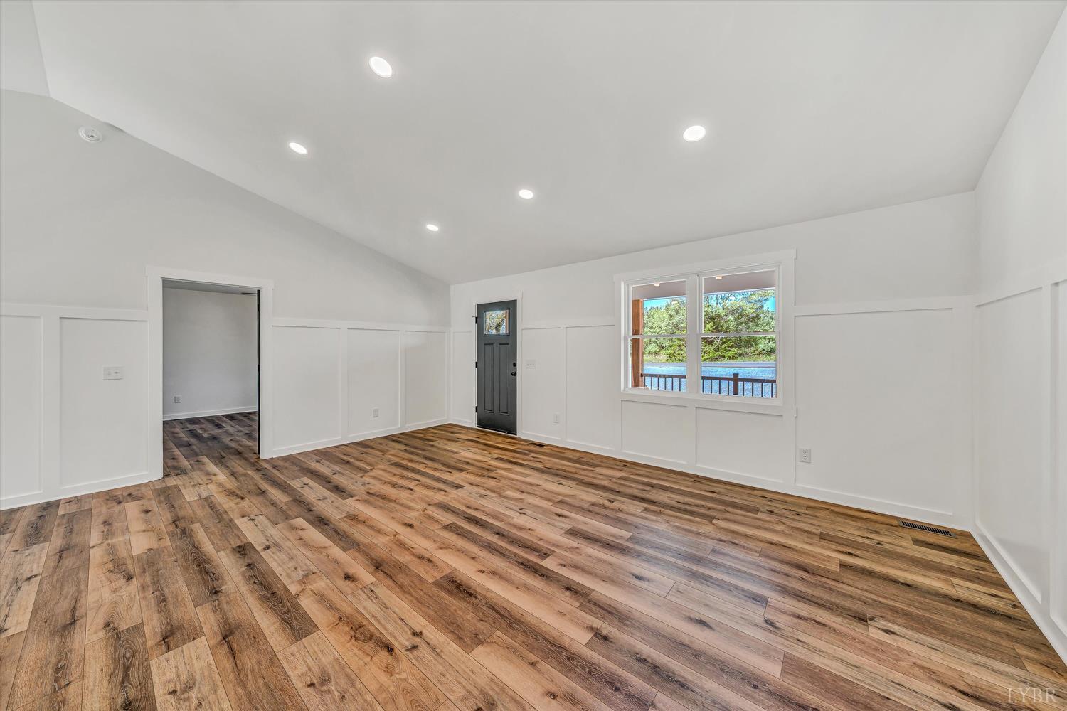 1484 White House Road Moneta, VA 24121 - Photo 4 of 27 a view of an empty room with wooden floor and window