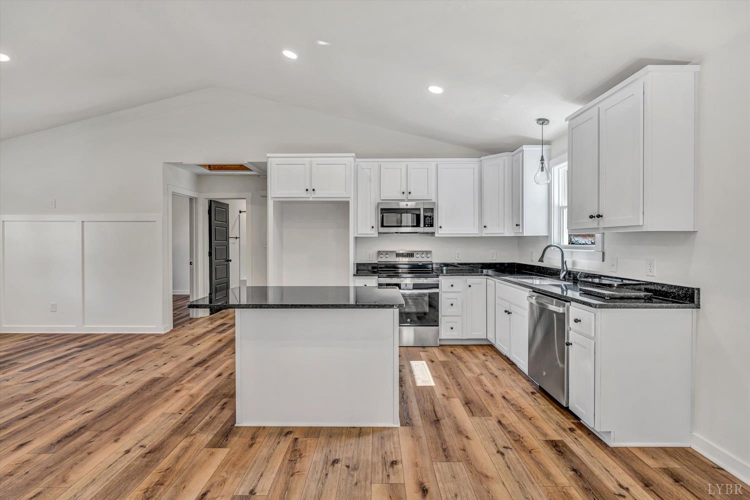 1484 White House Road Moneta, VA 24121 - Photo 6 of 27 a kitchen with stainless steel appliances a stove top oven a sink and a refrigerator