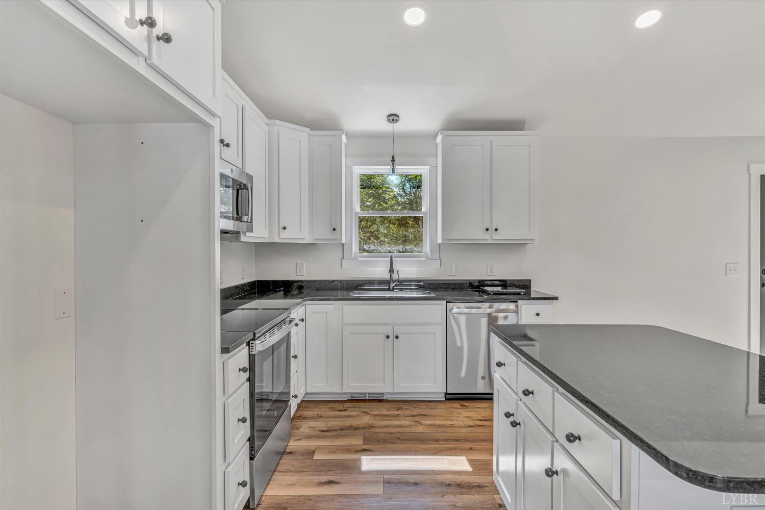 1484 White House Road Moneta, VA 24121 - Photo 8 of 27 a kitchen with stainless steel appliances granite countertop a stove and a sink