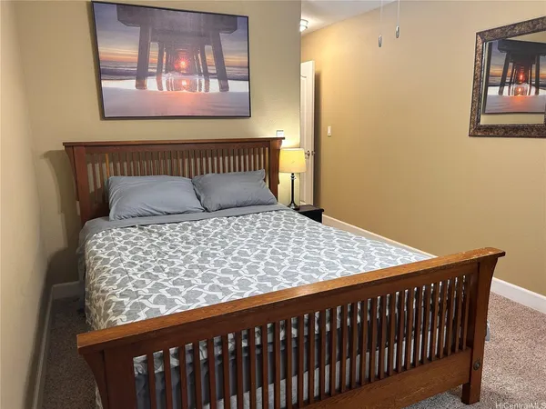 a bedroom with bed and a window