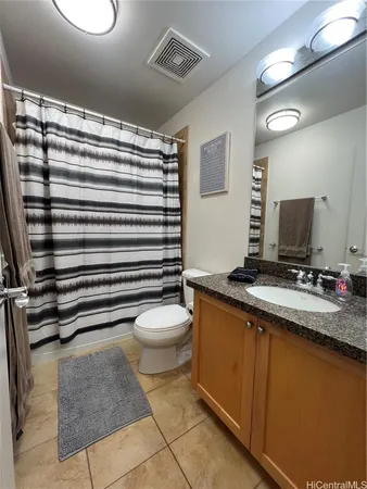 a bathroom with a toilet sink and shower