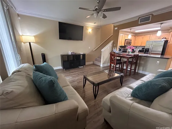 a living room with furniture and a flat screen tv