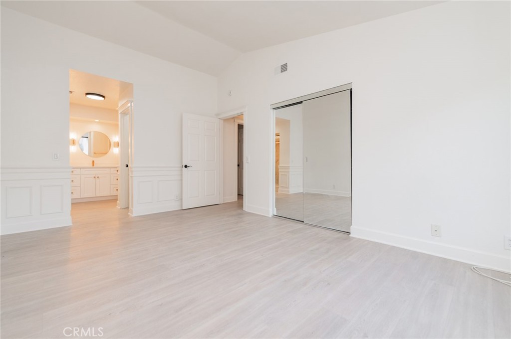 20 Rock Cliff Place Phillips Ranch, CA 91766 - Photo 12 of 17 an empty room with mirror and entrance