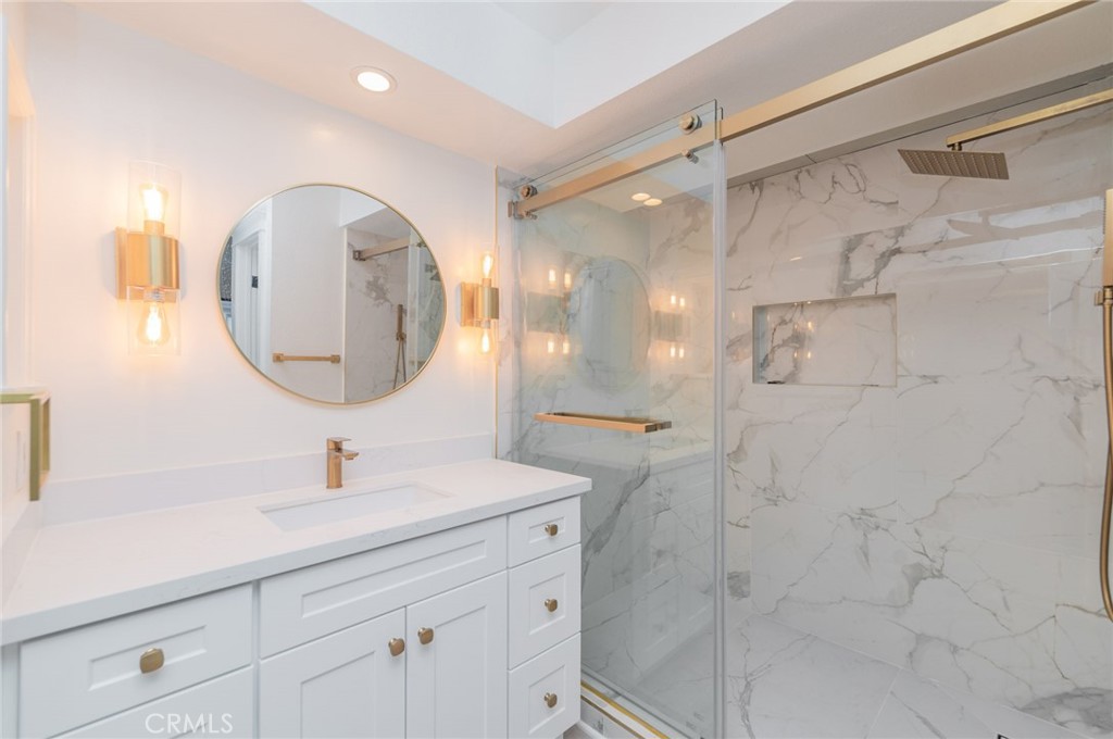 20 Rock Cliff Place Phillips Ranch, CA 91766 - Photo 13 of 17 a bathroom with a double vanity sink mirror and shower