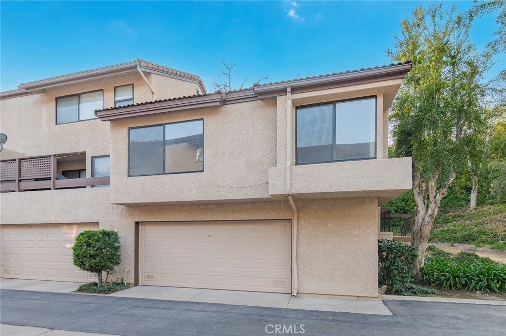 20 Rock Cliff Place Phillips Ranch, CA 91766 - Photo 17 of 17 a front view of a house with a yard and garage