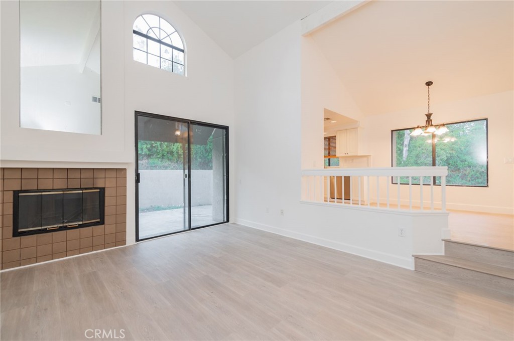 20 Rock Cliff Place Phillips Ranch, CA 91766 - Photo 3 of 17 an empty room with windows and fireplace