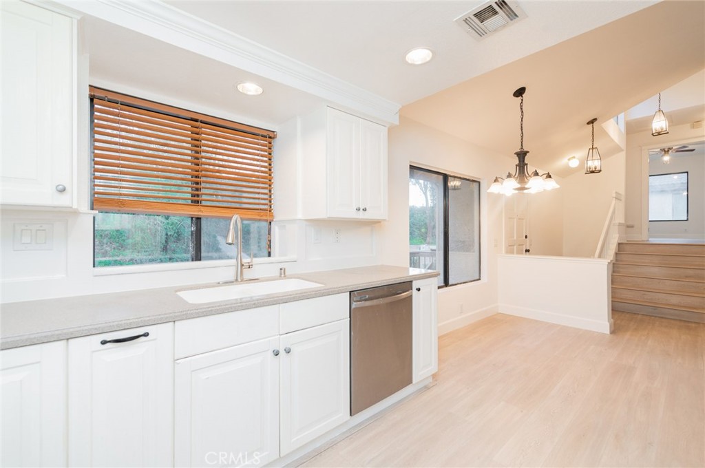 20 Rock Cliff Place Phillips Ranch, CA 91766 - Photo 6 of 17 a kitchen with a sink cabinets and window