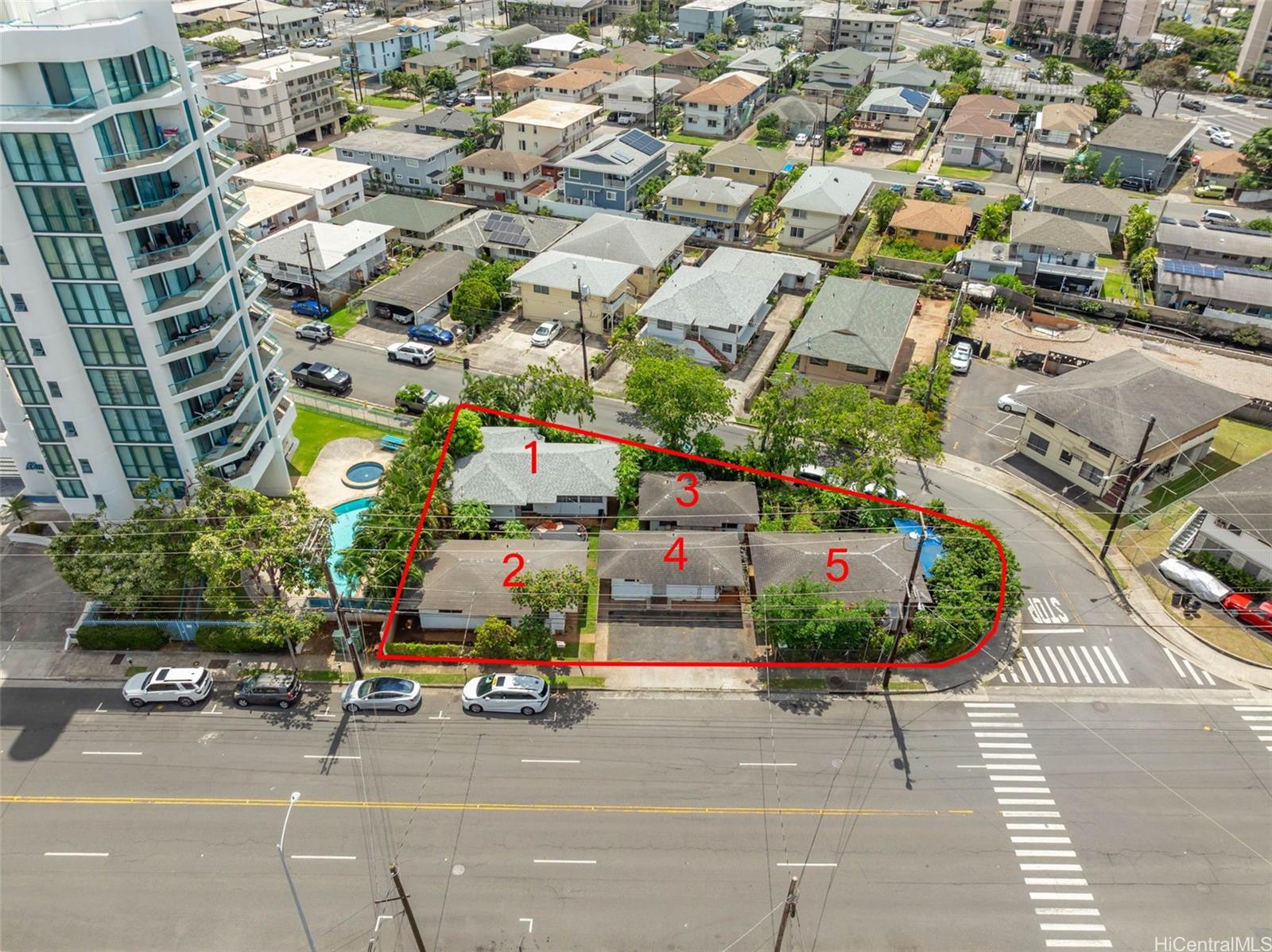 735 Isenberg Street Honolulu, HI 96826 - Photo 1 of 17 an outdoor space with lots of buildings in the background