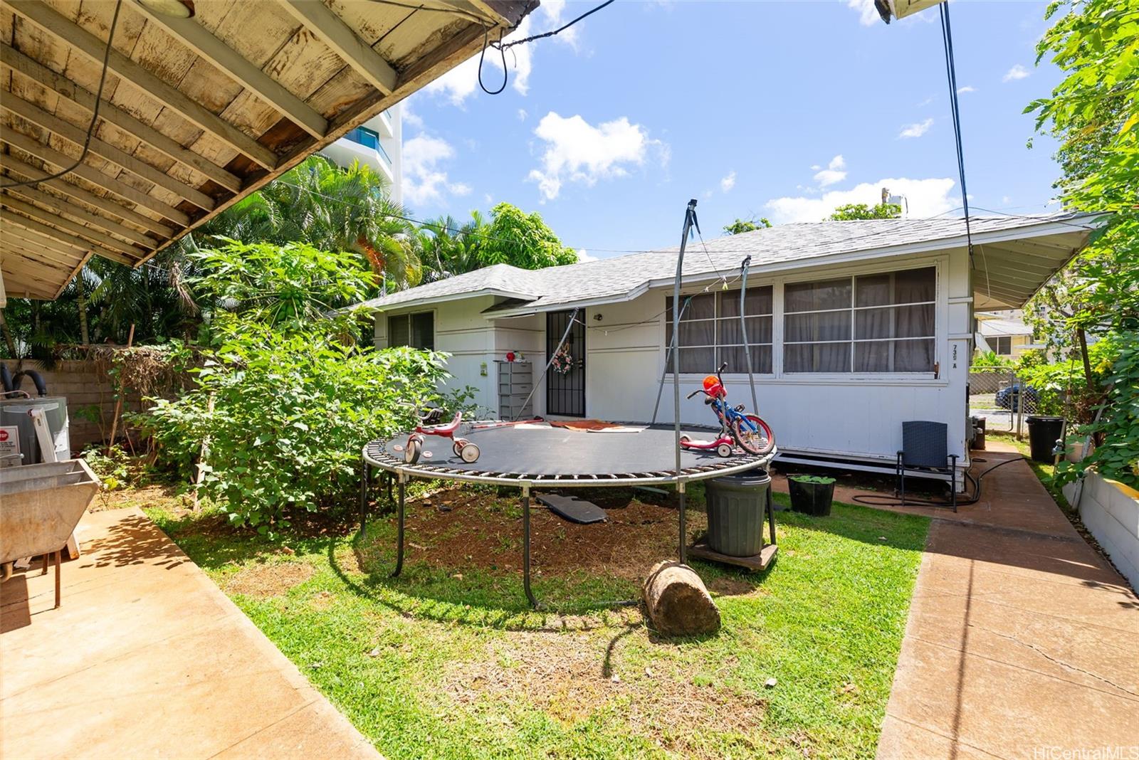 735 Isenberg Street Honolulu, HI 96826 - Photo 12 of 17 a view of a backyard with plants and patio