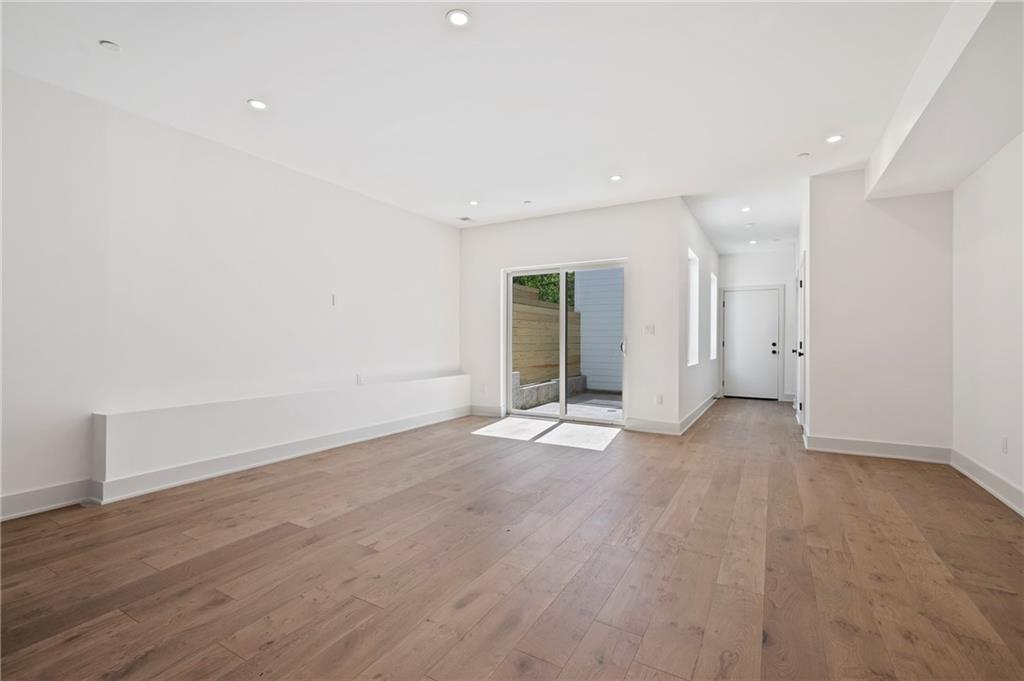 226 38th Street Pittsburgh, PA 15201 - Photo 16 of 42 wooden floor in an empty room with a window