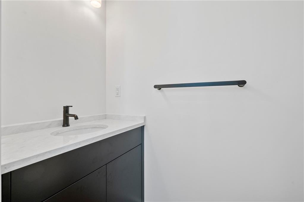 226 38th Street Pittsburgh, PA 15201 - Photo 17 of 42 a close up of a sink and a mirror