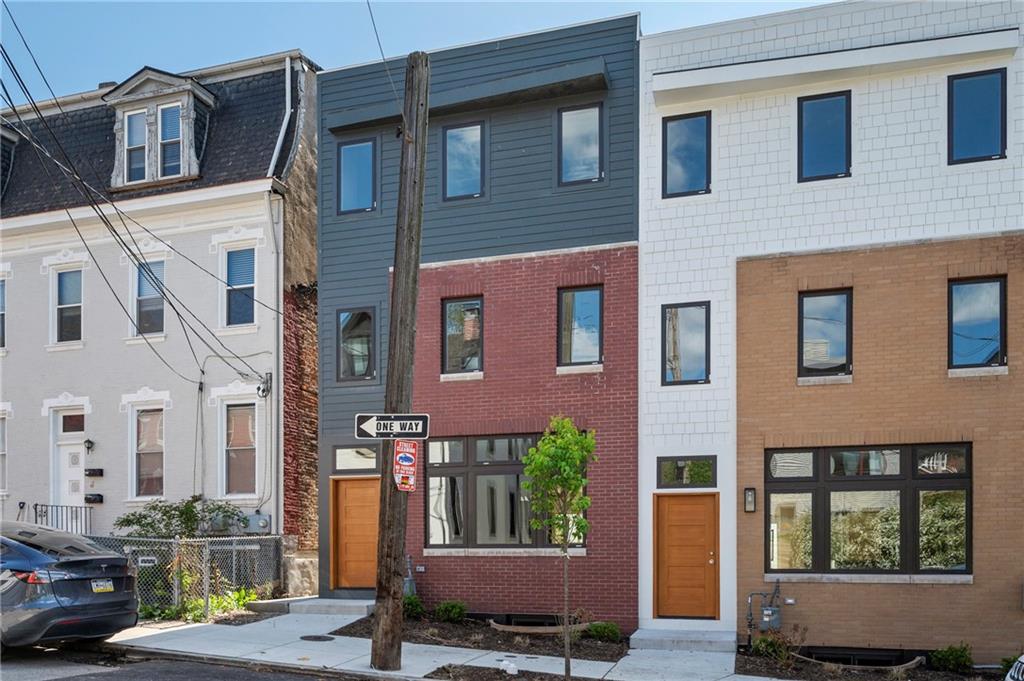 226 38th Street Pittsburgh, PA 15201 - Photo 2 of 42 a view of a brick building with many windows