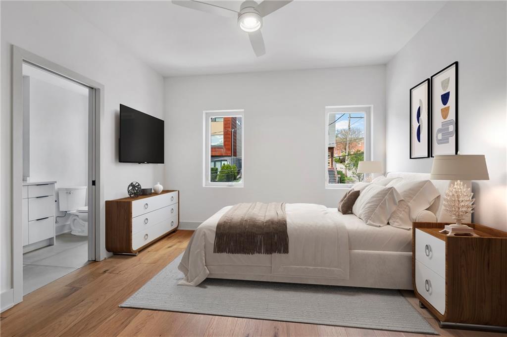 226 38th Street Pittsburgh, PA 15201 - Photo 26 of 42 a bedroom with furniture and a flat screen tv