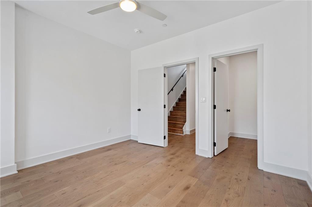 226 38th Street Pittsburgh, PA 15201 - Photo 28 of 42 an empty room with a closet and a ceiling fan