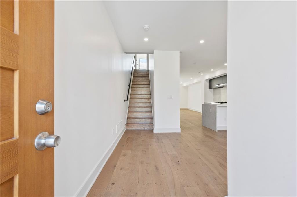 226 38th Street Pittsburgh, PA 15201 - Photo 3 of 42 a view of a hallway with wooden floor and staircase