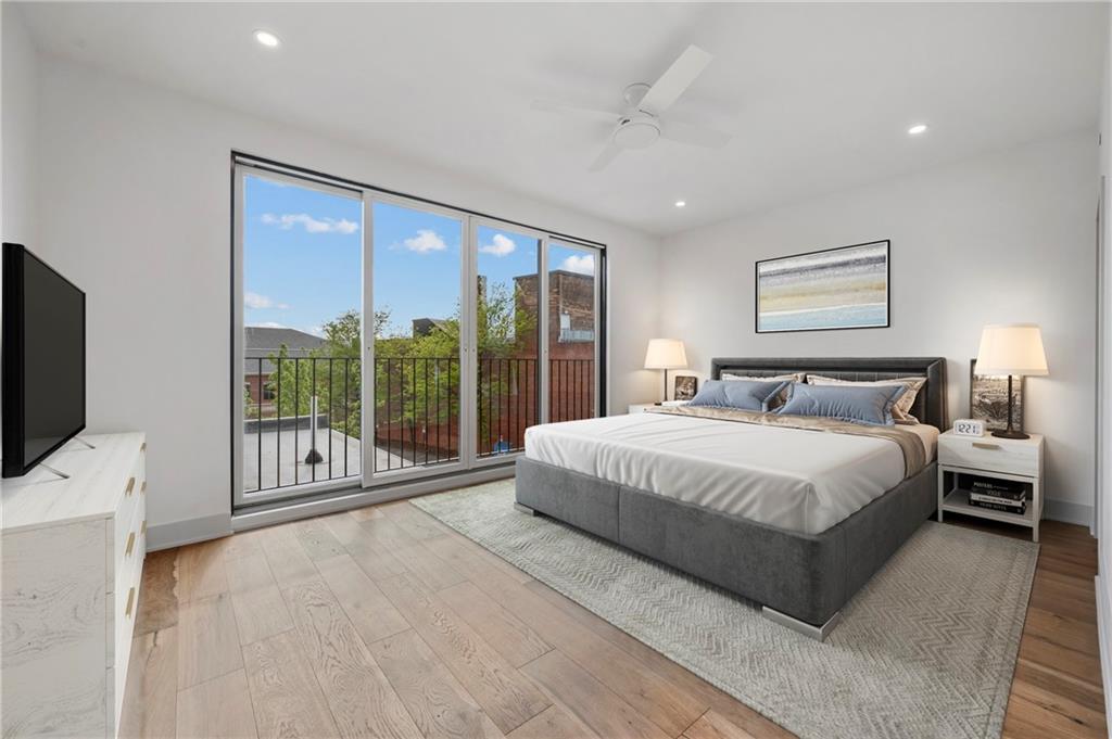 226 38th Street Pittsburgh, PA 15201 - Photo 31 of 42 a spacious bedroom with a large bed and a flat tv screen on dresser