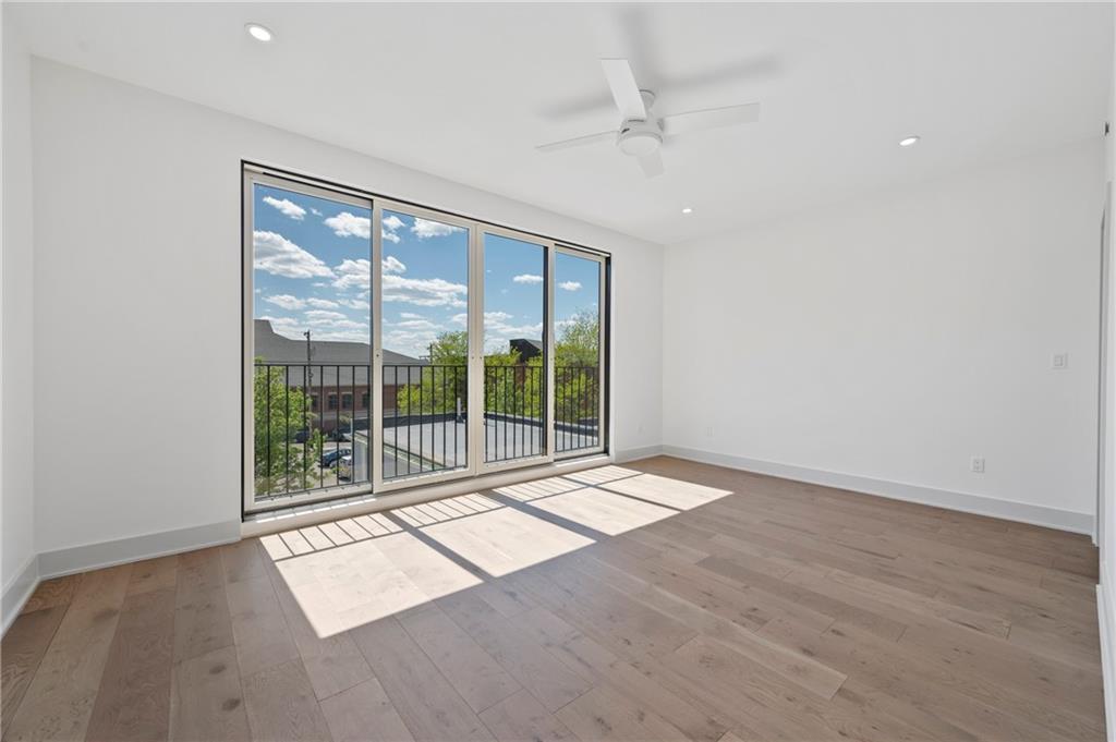 226 38th Street Pittsburgh, PA 15201 - Photo 32 of 42 a view of an empty room with wooden floor and a window