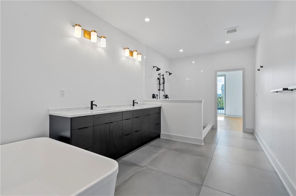 226 38th Street Pittsburgh, PA 15201 - Photo 36 of 42 a large white kitchen with a sink a refrigerator and a stove