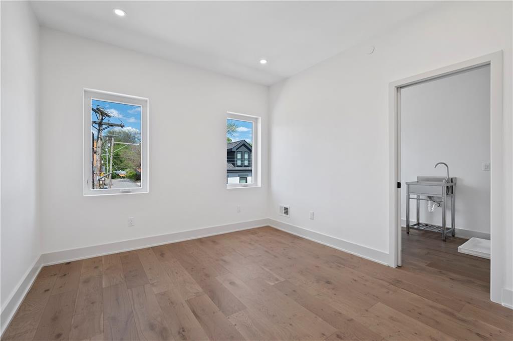 226 38th Street Pittsburgh, PA 15201 - Photo 38 of 42 a view of empty room with wooden floor and fan