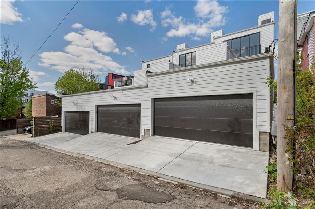 226 38th Street Pittsburgh, PA 15201 - Photo 41 of 42 a front view of a house with yard and garage