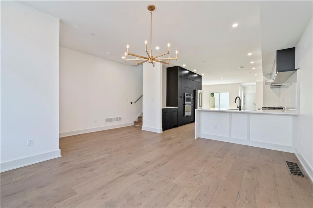 226 38th Street Pittsburgh, PA 15201 - Photo 7 of 42 a view of a kitchen with a sink and a refrigerator