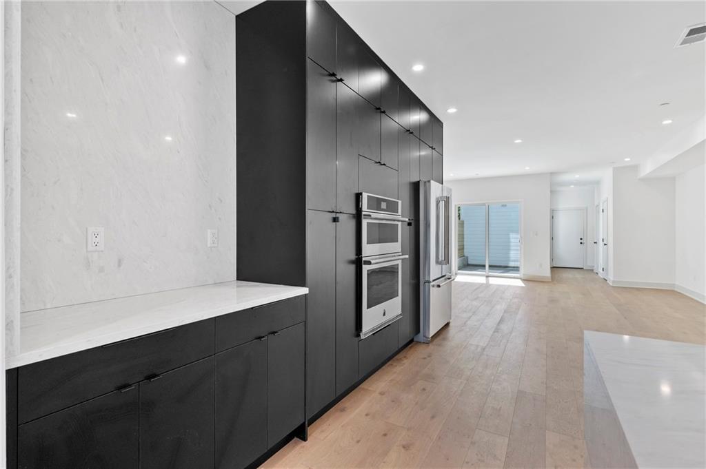 226 38th Street Pittsburgh, PA 15201 - Photo 10 of 42 a view of a kitchen with refrigerator and sink