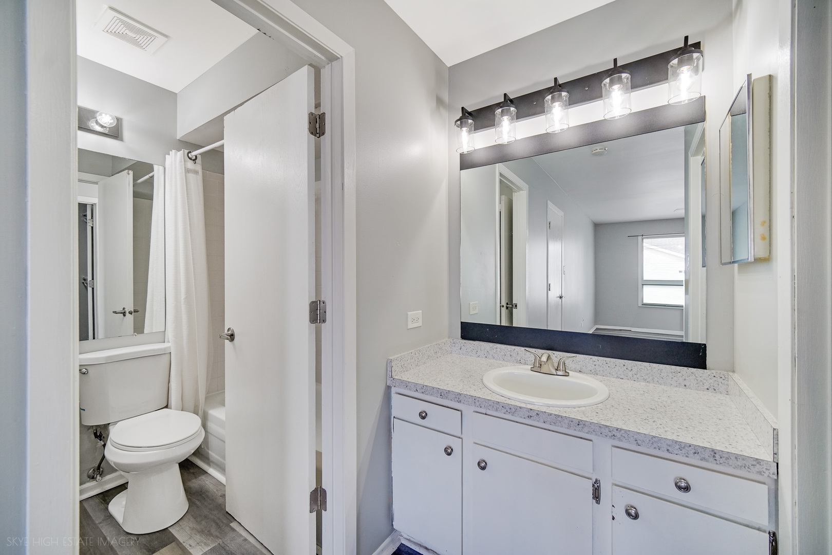 103 Red Barn Road, Unit 103 Matteson, IL 60443 - Photo 11 of 17 a bathroom with a sink a toilet and a mirror
